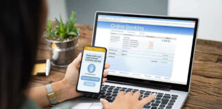 Person using online banking on laptop and smartphone