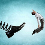 Man gets kicked by oversized shoe on spring