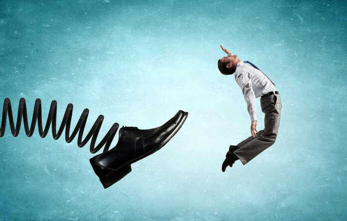 Man gets kicked by oversized shoe on spring