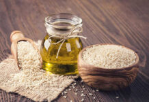 The Shocking Truth About Rancid Oils Jar of oil sesame seeds in bowl