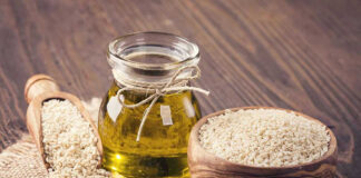 Jar of oil sesame seeds in bowl