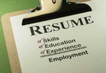 A resume checklist on a clipboard highlighting skills, education, experience, and employment