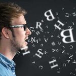 ADHD: The Hidden Key to Genius Profile view of a man speaking with letters floating around him