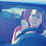 Scientists SHOCKED: Stress Actually Extends Lifespan Angry woman gripping the steering wheel in a car