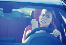 Scientists SHOCKED: Stress Actually Extends Lifespan Angry woman gripping the steering wheel in a car